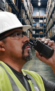 TP2210-MDSidebar Warehouse-Man holding Tait TP2210 radio