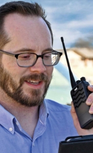 Man holding Tait TP2210 radio Man holding Tait TP2210 radio